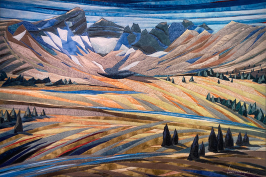 Stitched fabric tapestry reproduction of a mountain landscape with trees and a lake.